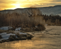 Picture of a sunrise over a snowy river